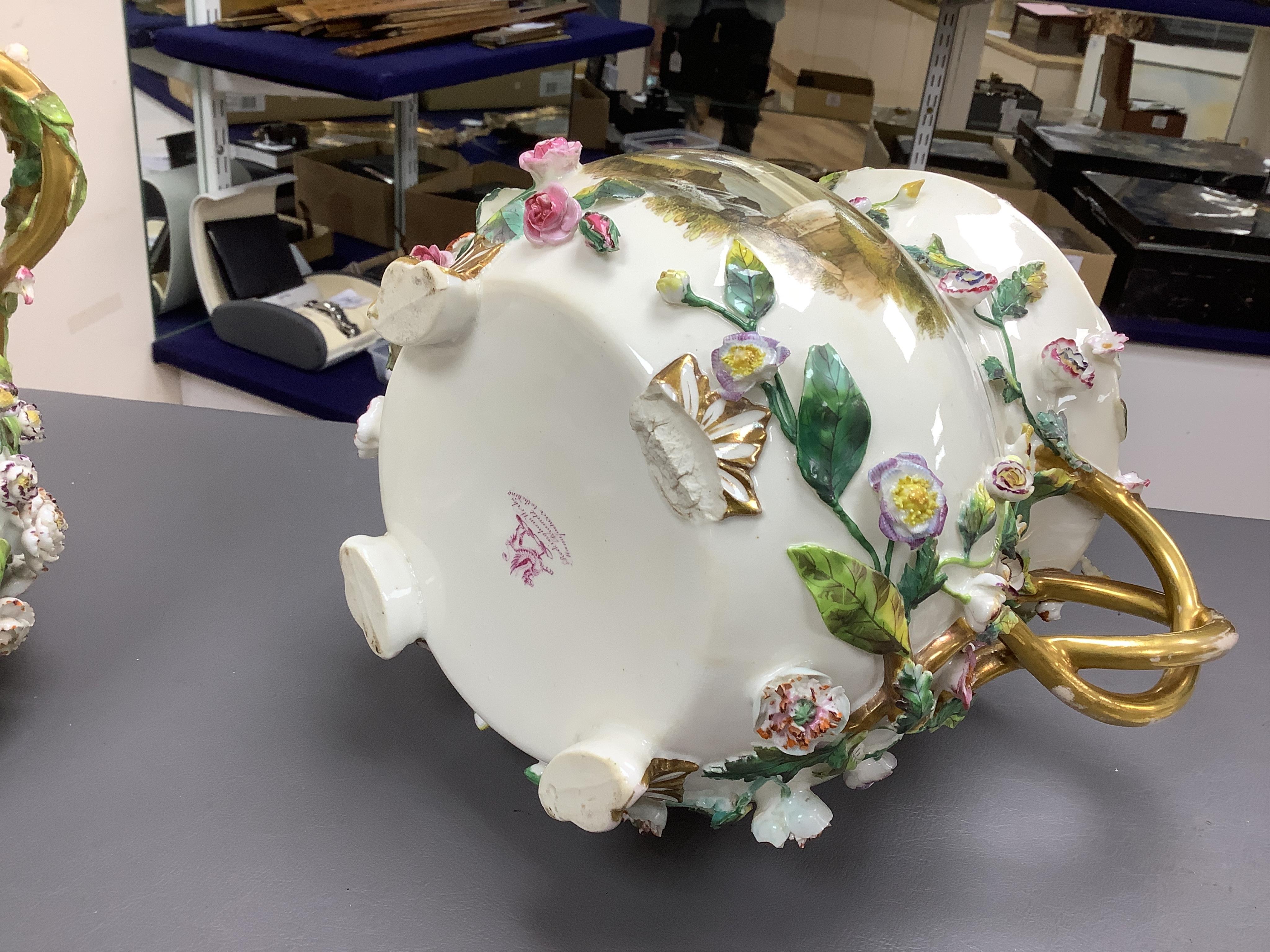 A pair of Rockingham two handled pot pourri vases and covers, c.1830-42, the first painted with two named views near Lyme, Dorsetshire and Stockly Bridge’, The second with an unnamed view of a monument by a lake, the rev